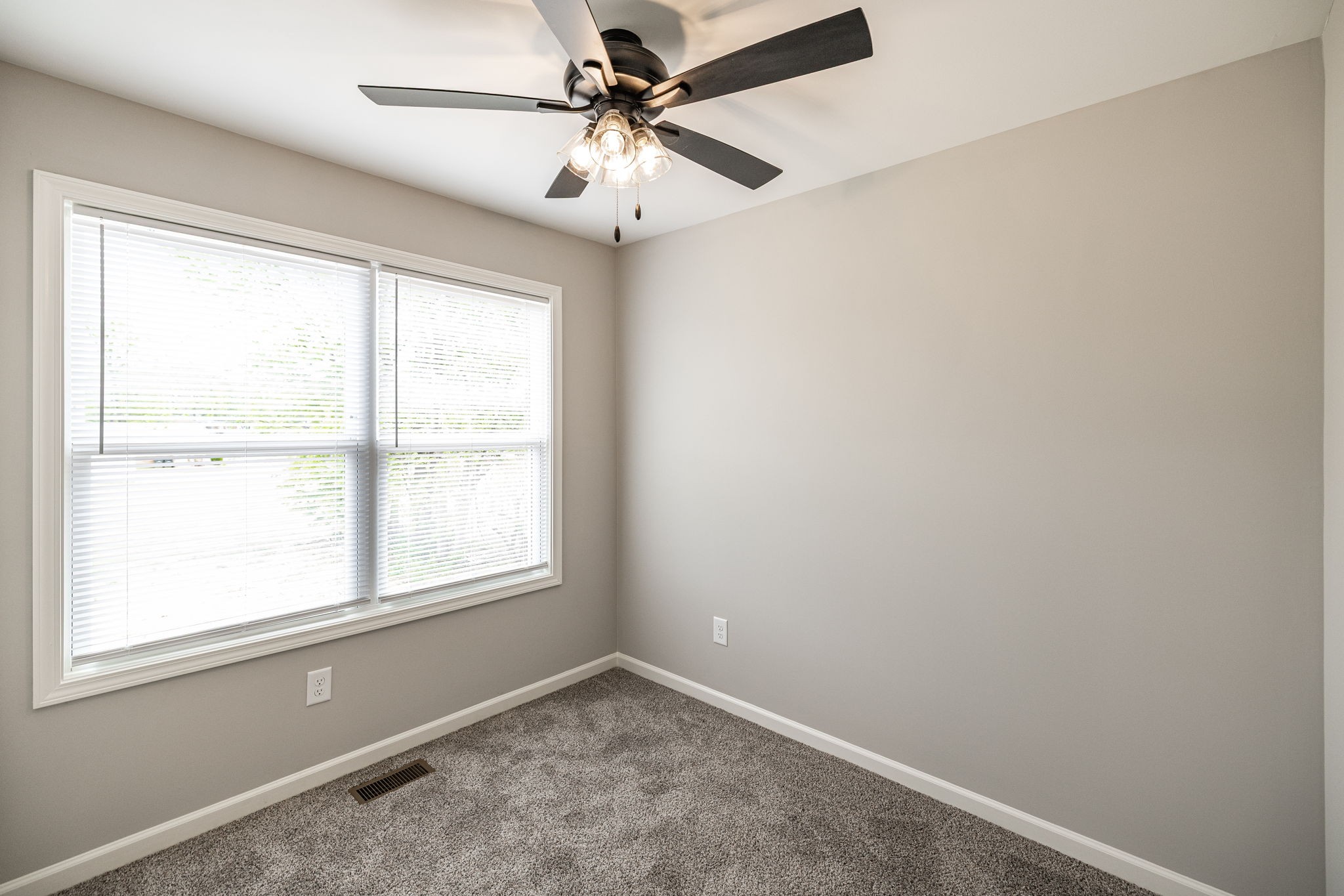 103 Portland Boulevard Portland, TN 37148 - Photo 97 of 100 an empty room with a window and a fan