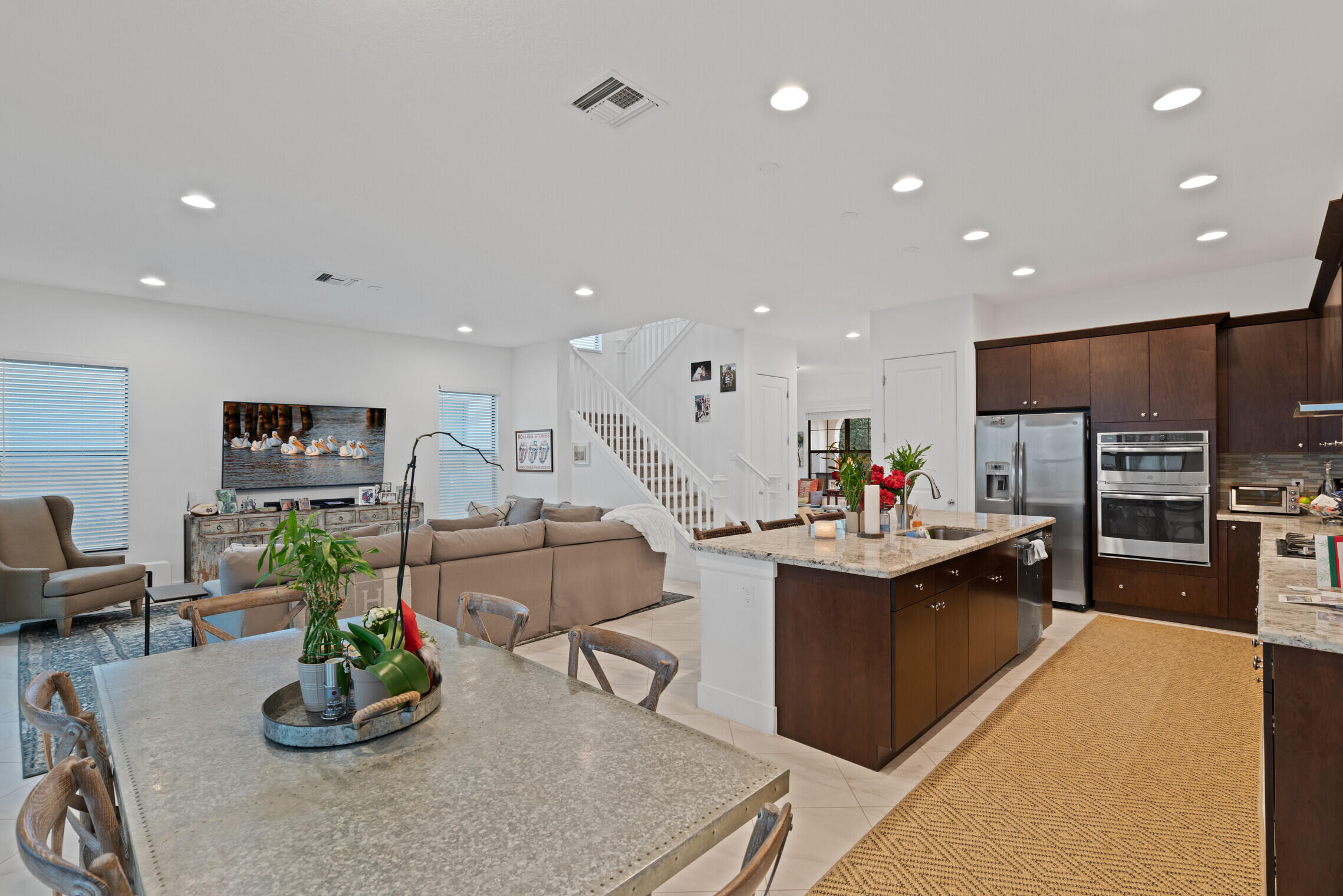 4084 Faraday Way Palm Beach Gardens, FL 33418 - Photo 16 of 43 a living room with kitchen island furniture and a potted plant