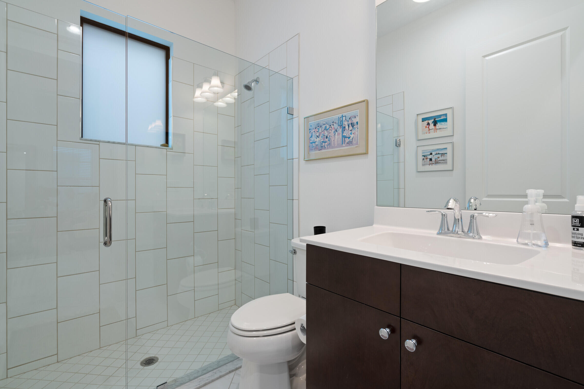 4084 Faraday Way Palm Beach Gardens, FL 33418 - Photo 18 of 43 a bathroom with a sink a toilet and shower