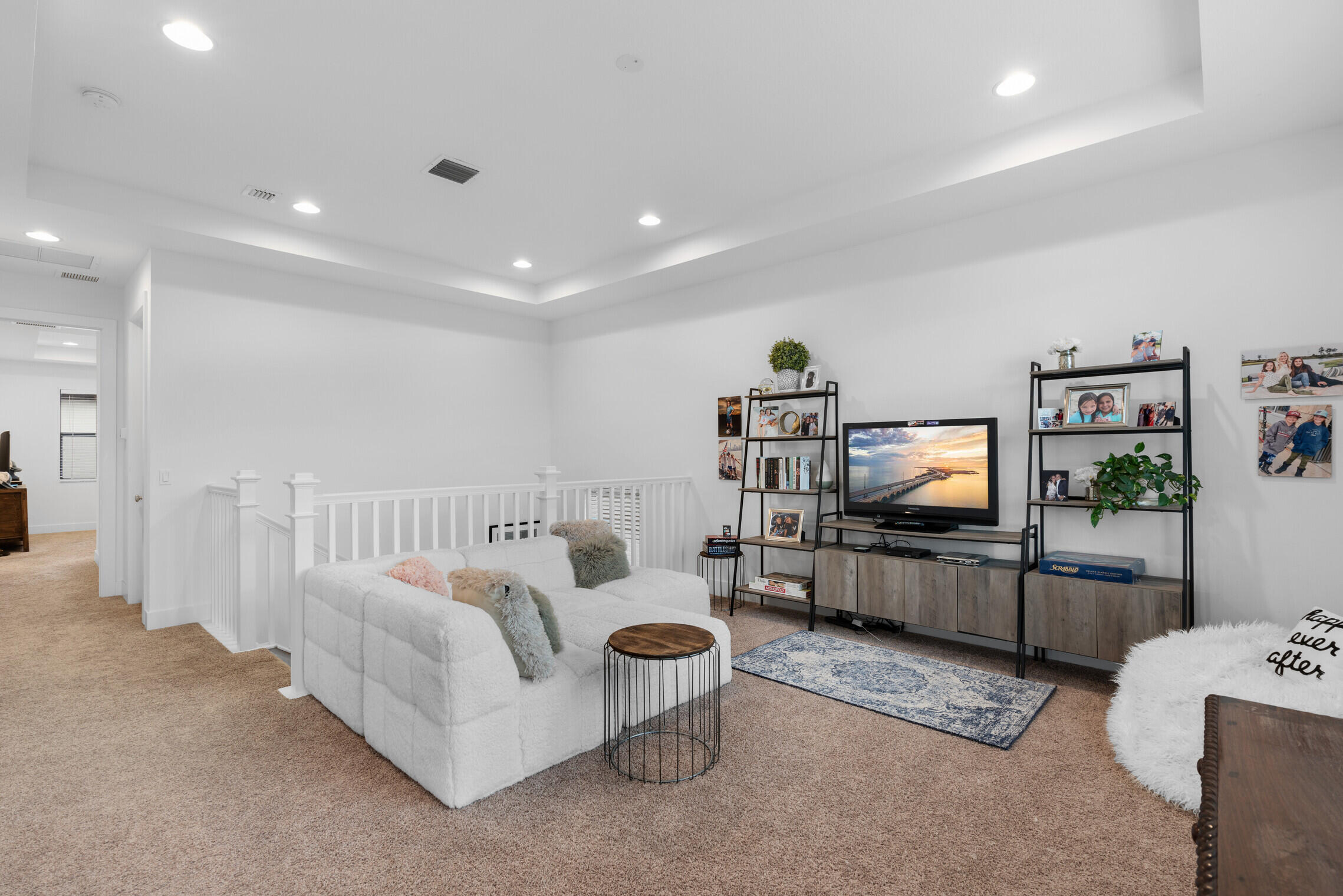 4084 Faraday Way Palm Beach Gardens, FL 33418 - Photo 19 of 43 a living room with furniture and a flat screen tv