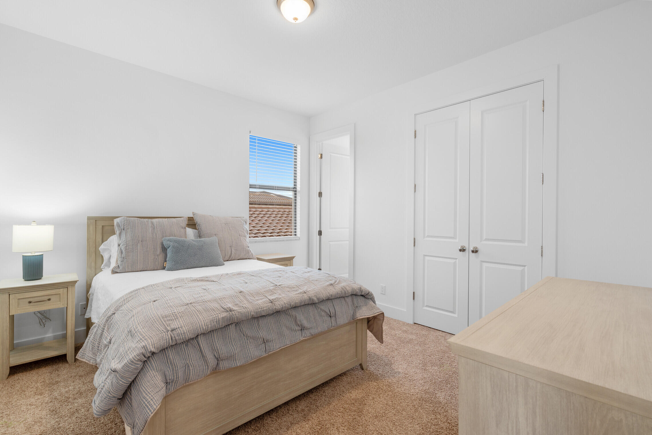 4084 Faraday Way Palm Beach Gardens, FL 33418 - Photo 25 of 43 a bedroom with a bed and a closet