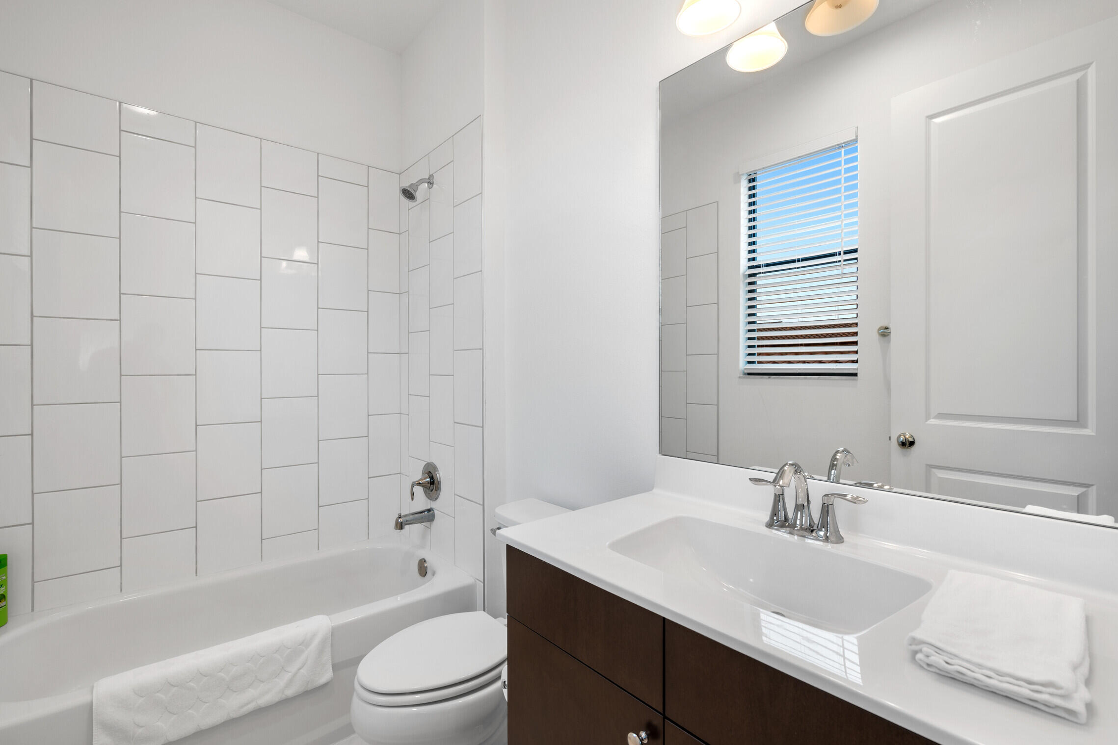 4084 Faraday Way Palm Beach Gardens, FL 33418 - Photo 26 of 43 a bathroom with a sink a toilet and shower