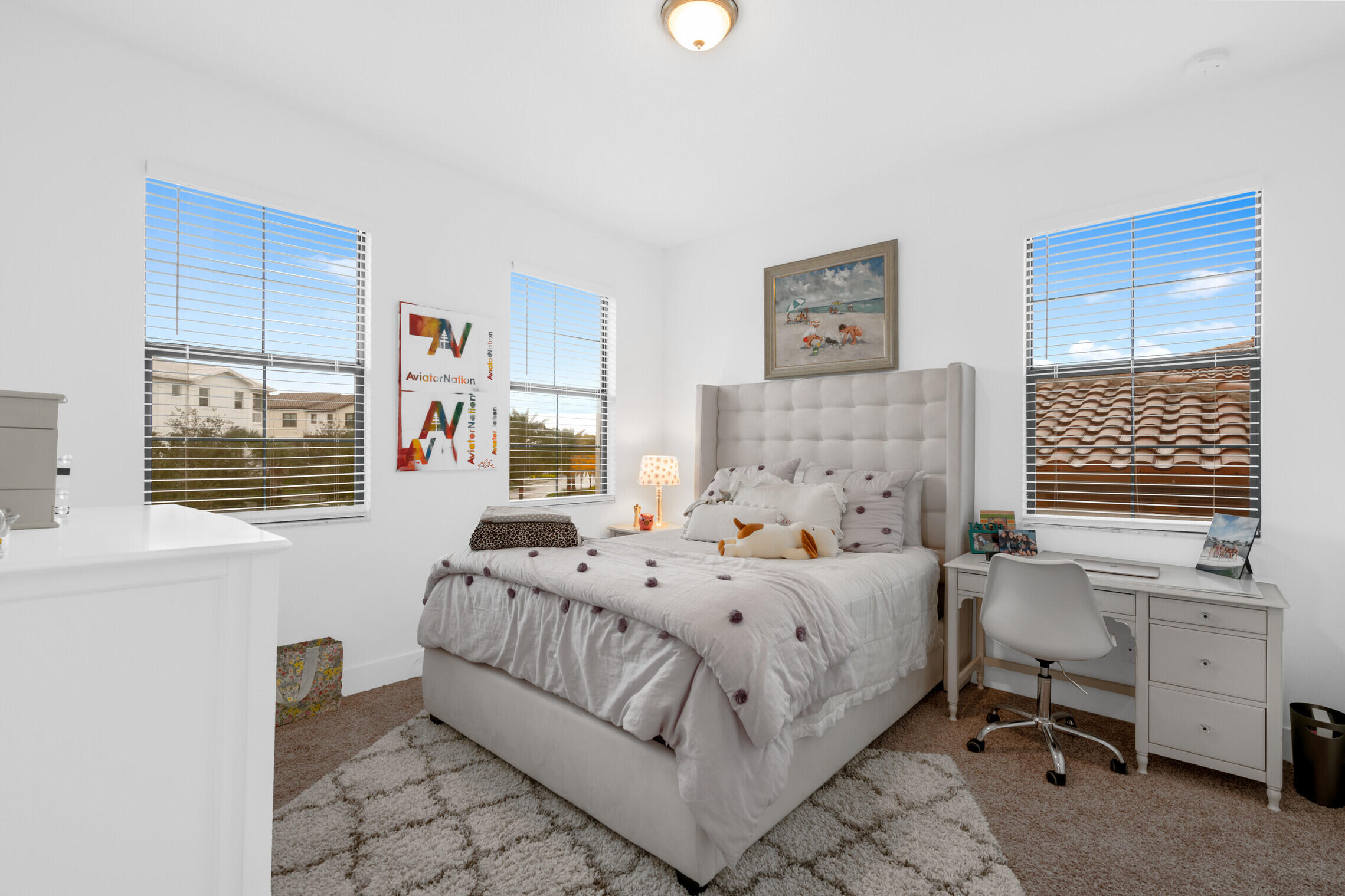 4084 Faraday Way Palm Beach Gardens, FL 33418 - Photo 27 of 43 a bedroom with a bed and a window