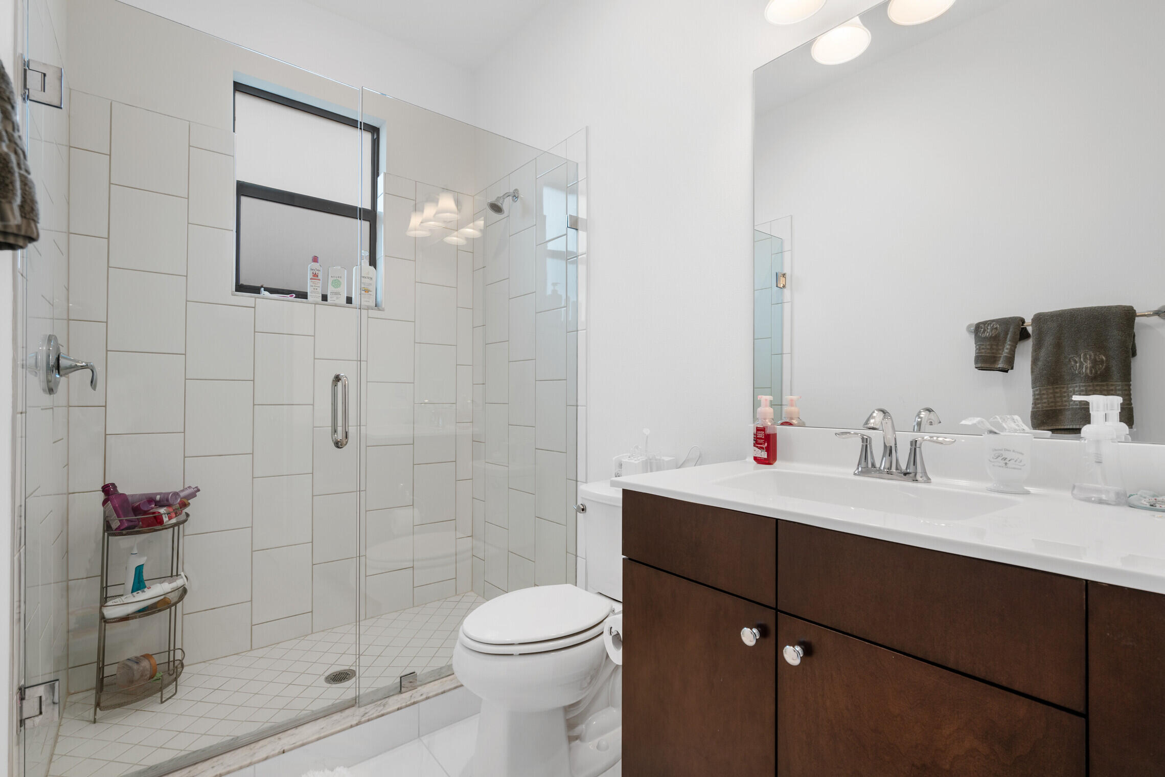 4084 Faraday Way Palm Beach Gardens, FL 33418 - Photo 28 of 43 a bathroom with a sink toilet a mirror and shower