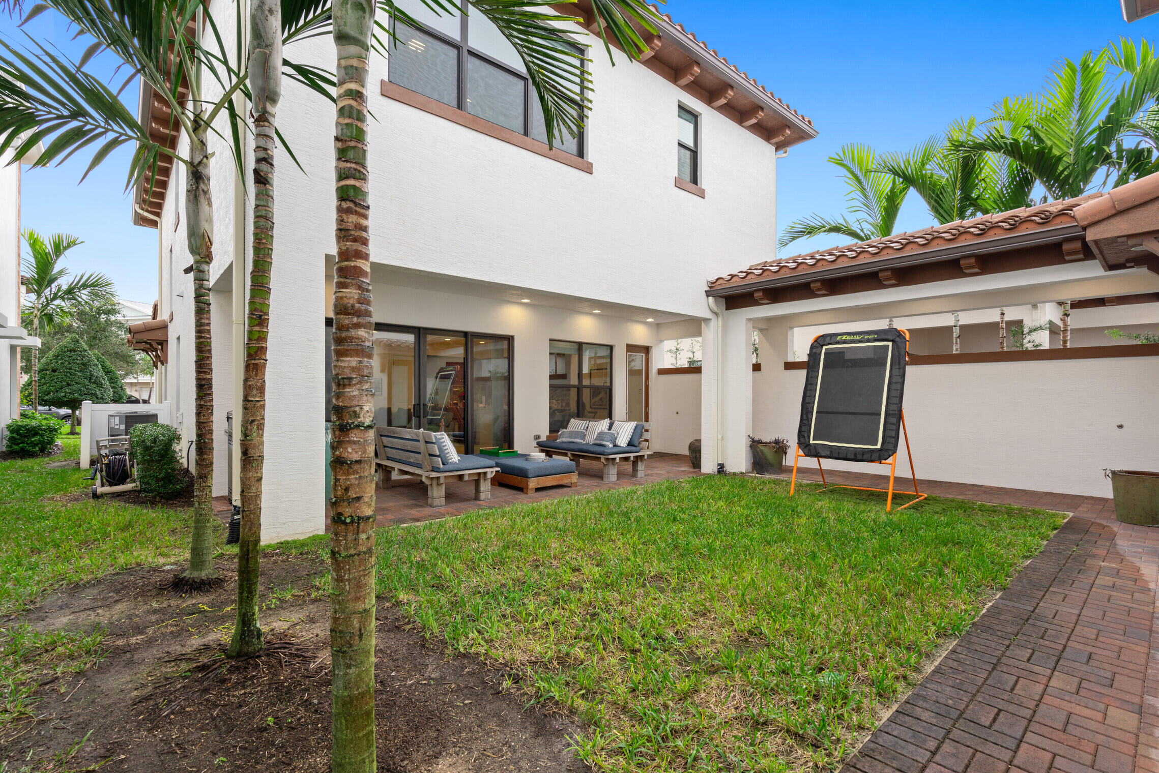 4084 Faraday Way Palm Beach Gardens, FL 33418 - Photo 30 of 43 a house view with a sitting space and garden space