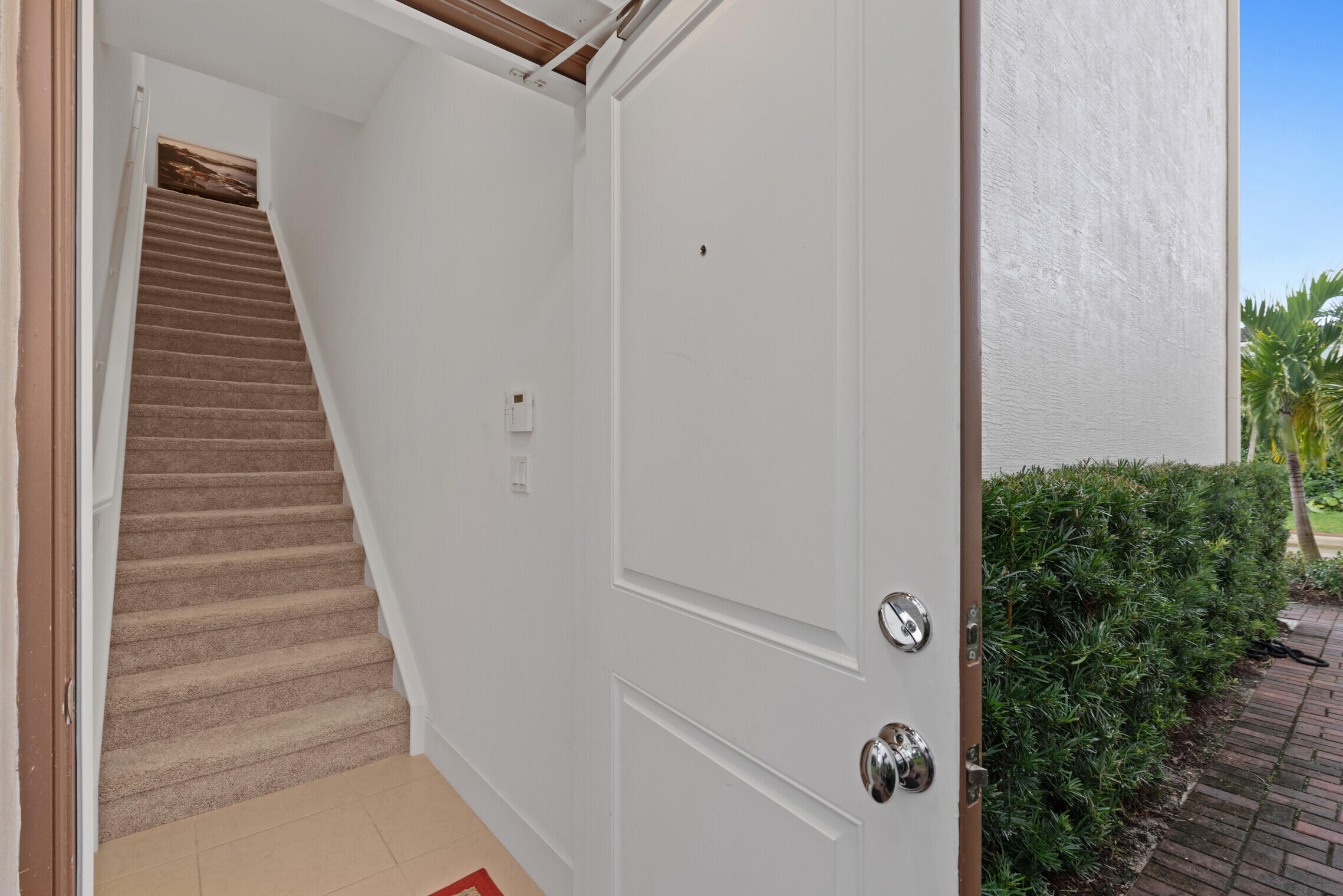 4084 Faraday Way Palm Beach Gardens, FL 33418 - Photo 31 of 43 a view of a hallway with staircase