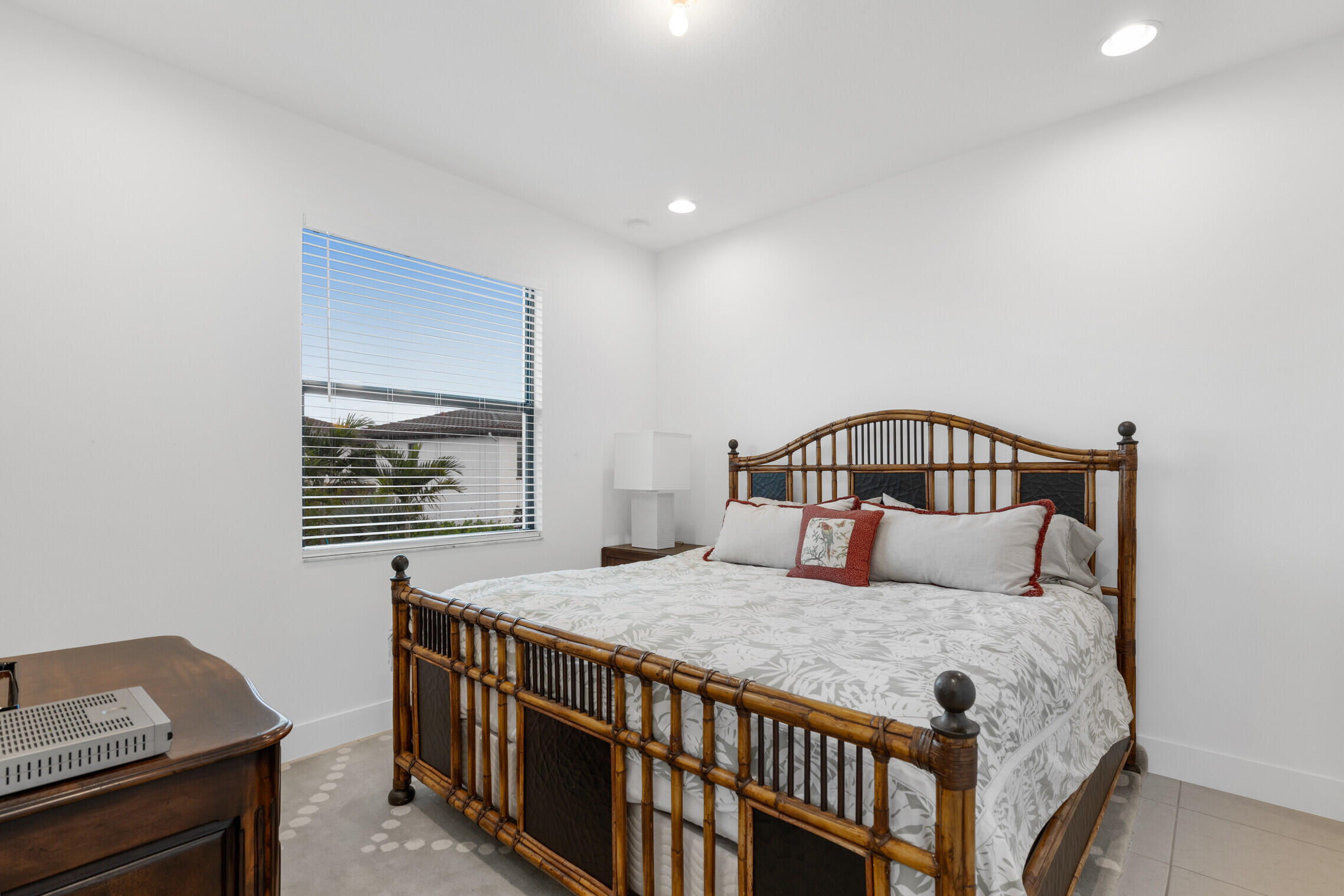 4084 Faraday Way Palm Beach Gardens, FL 33418 - Photo 36 of 43 a bedroom with a bed and a window