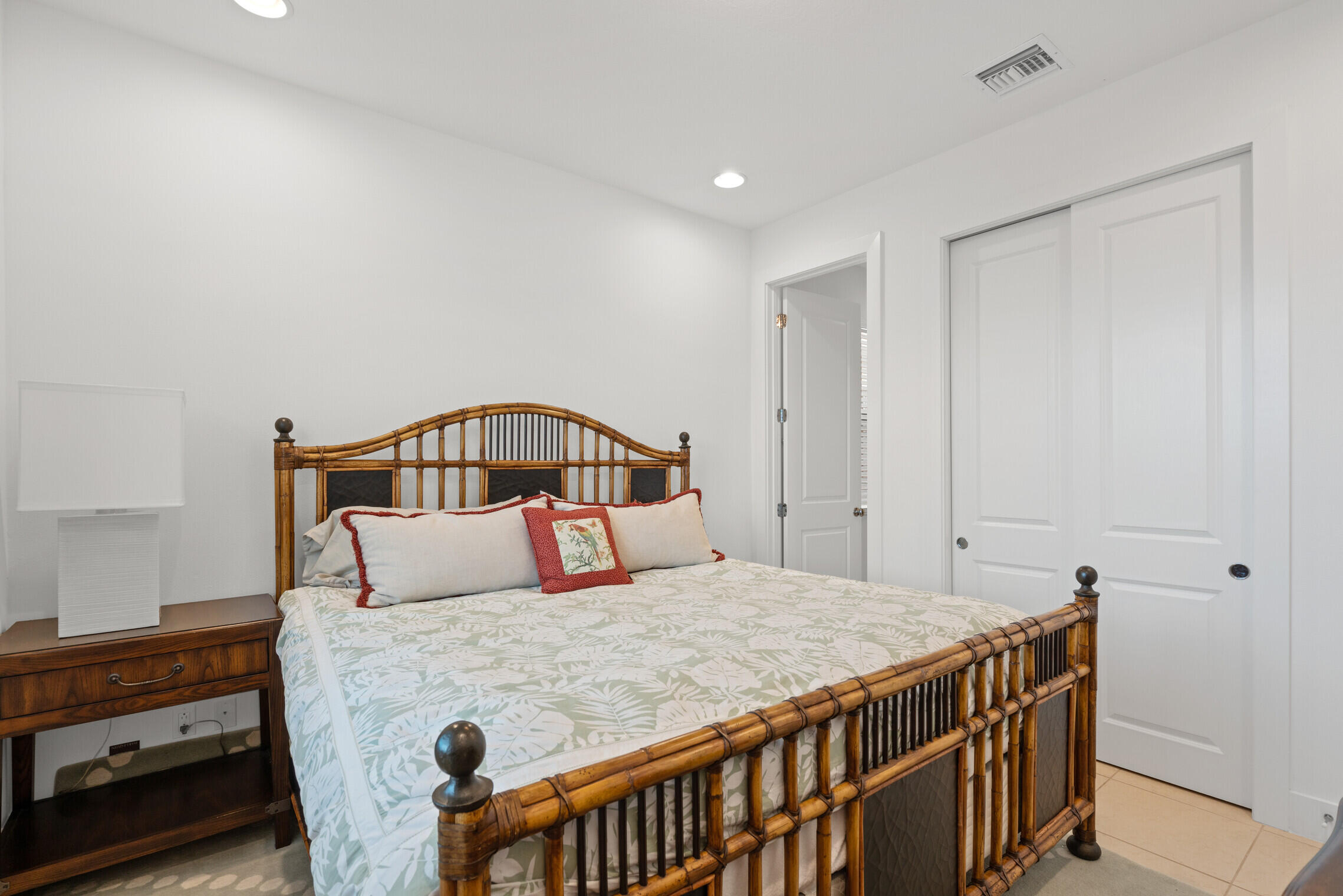 4084 Faraday Way Palm Beach Gardens, FL 33418 - Photo 37 of 43 a bedroom with a bed and a dresser