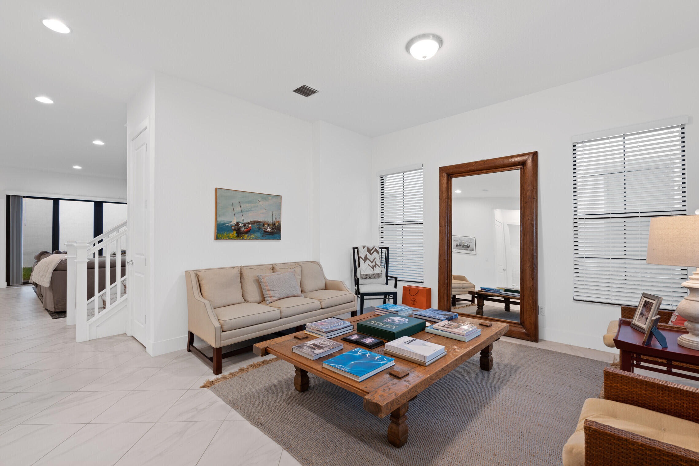4084 Faraday Way Palm Beach Gardens, FL 33418 - Photo 8 of 43 a living room with furniture a rug and a large window