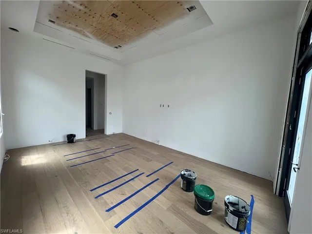 a view of workspace with furniture and wooden floor