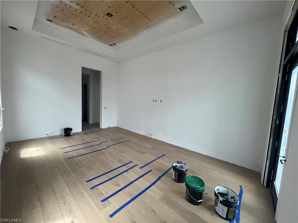 6708 Newport Road Naples, FL 34109 - Photo 4 of 50 a view of workspace with furniture and wooden floor