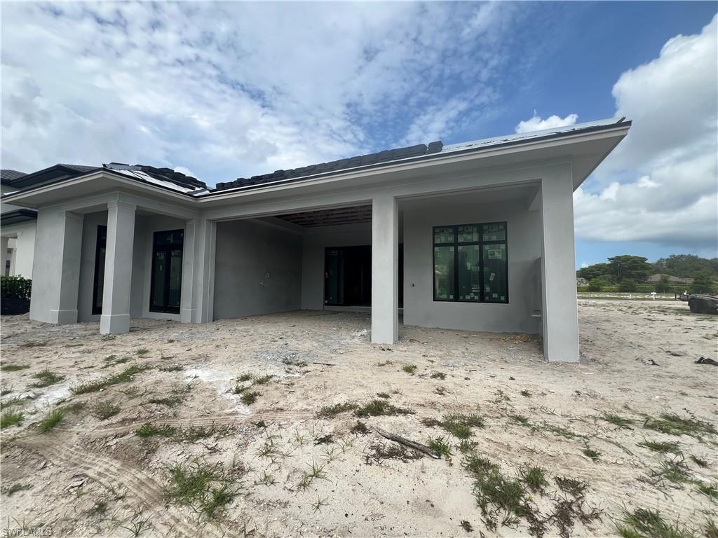 6708 Newport Road Naples, FL 34109 - Photo 7 of 50 a view of a house with a snow in the yard