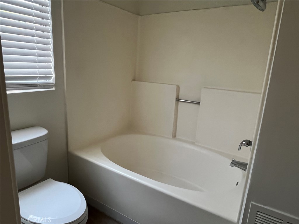 11568 Norgate Circle Corona, CA 92878 - Photo 18 of 21 a white bath tub sitting next to a white toilet