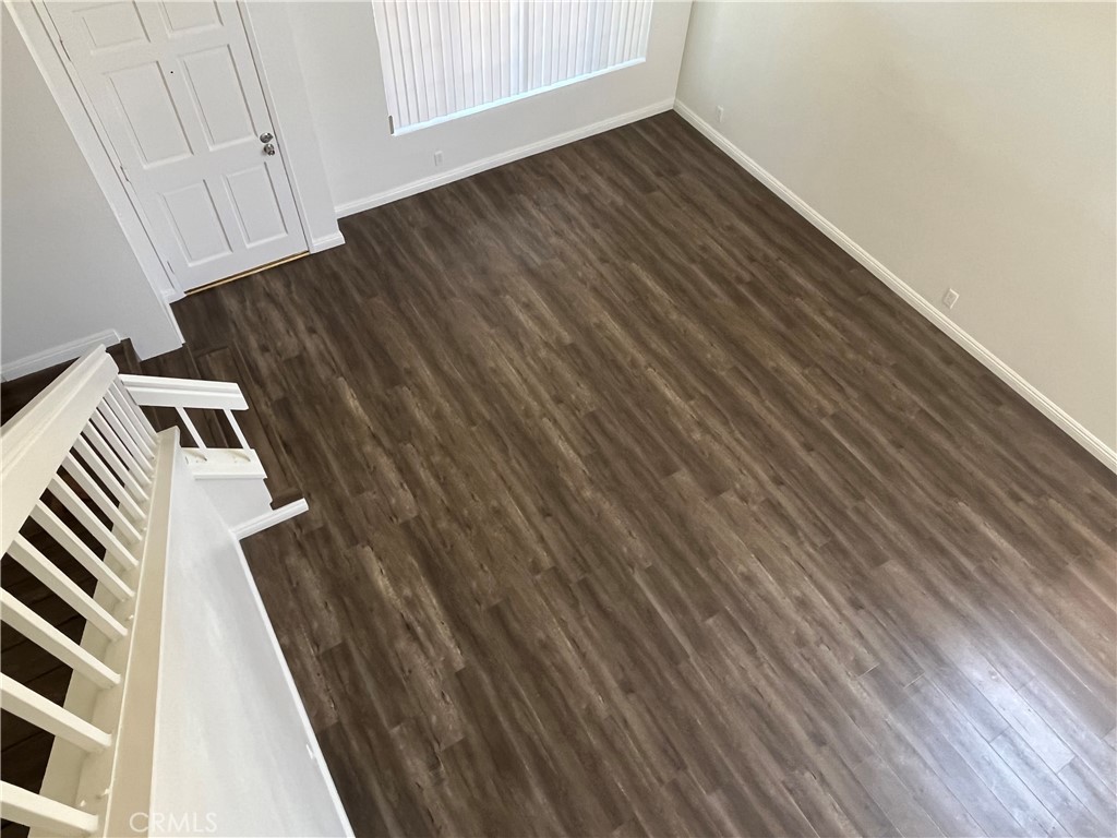 11568 Norgate Circle Corona, CA 92878 - Photo 21 of 21 a view of a room with wooden floor