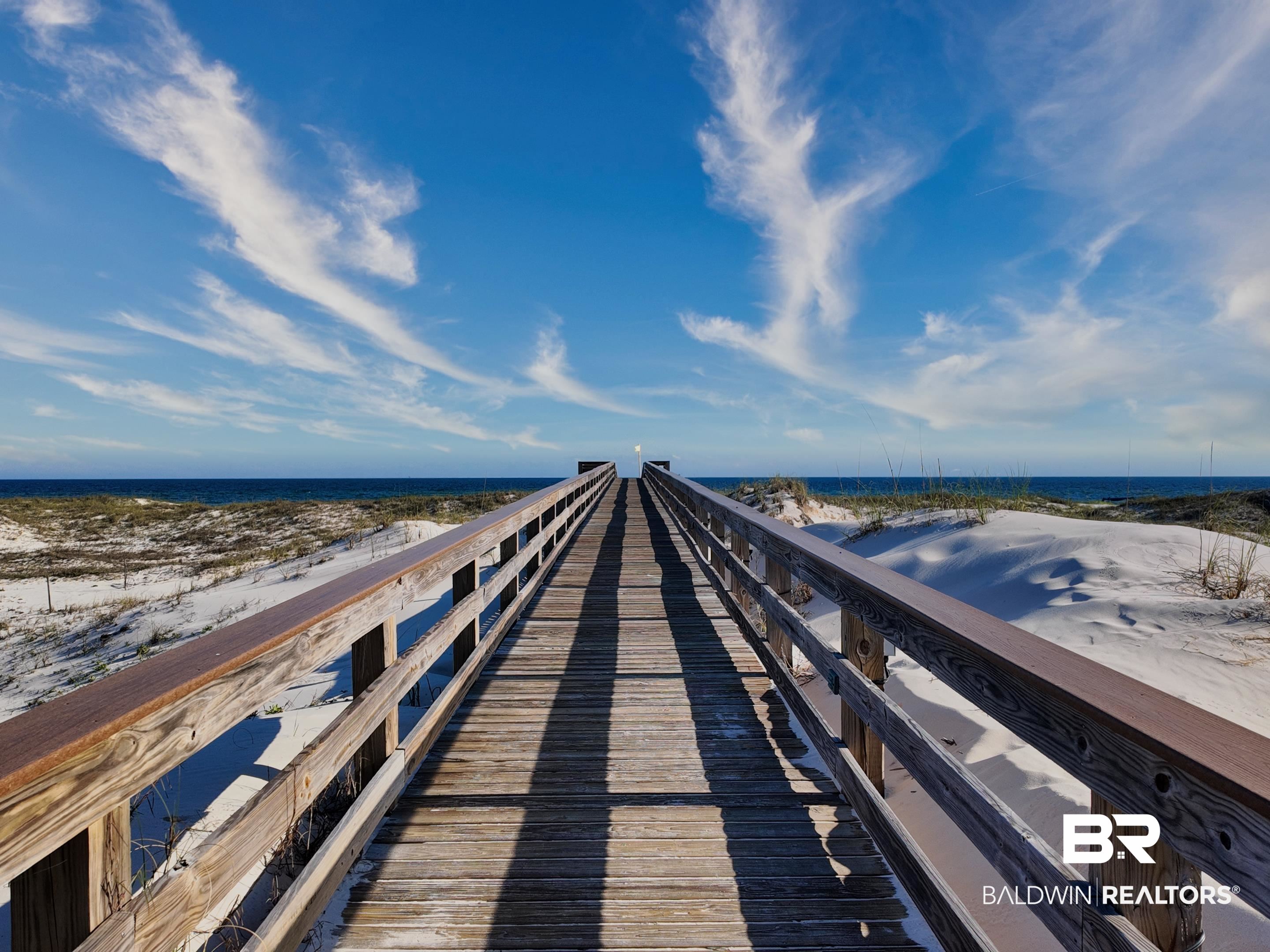 400 Plantation Road, Unit 1113 Gulf Shores, AL 36542 - Photo 14 of 26 View of dock featuring a water view and a beach view