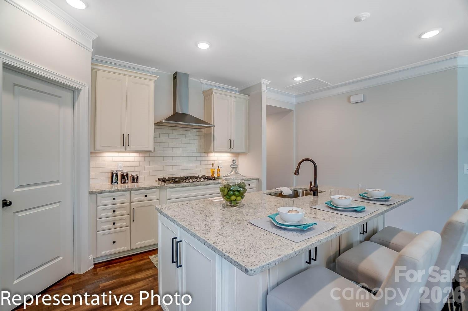 2038 Mantle Rdg Drive Indian Trail, NC 28079 - Photo 7 of 15 a kitchen with stainless steel appliances granite countertop a stove a sink dishwasher and cabinets