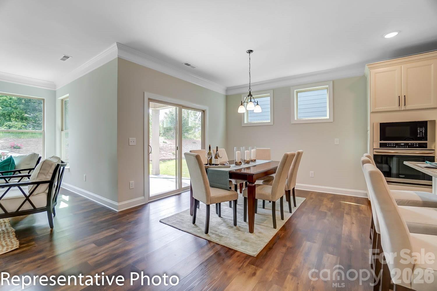 2038 Mantle Rdg Drive Indian Trail, NC 28079 - Photo 9 of 15 a view of a dining room with furniture window and wooden floor