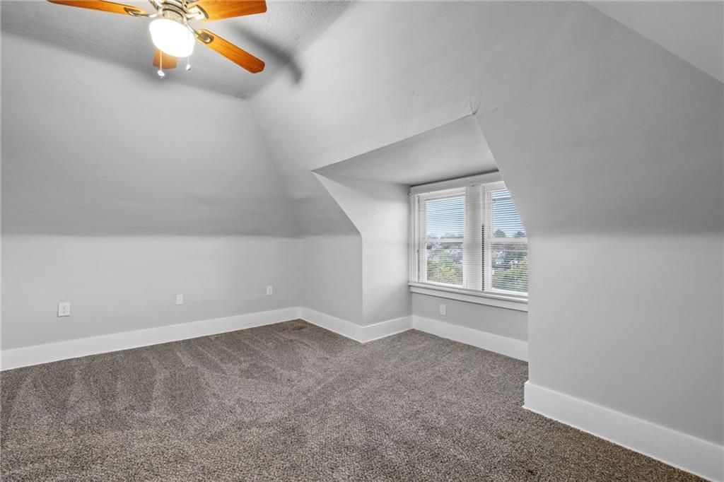 2923-2925 Brownsville Road Pittsburgh, PA 15227 - Photo 13 of 38 an empty room with windows and fireplace
