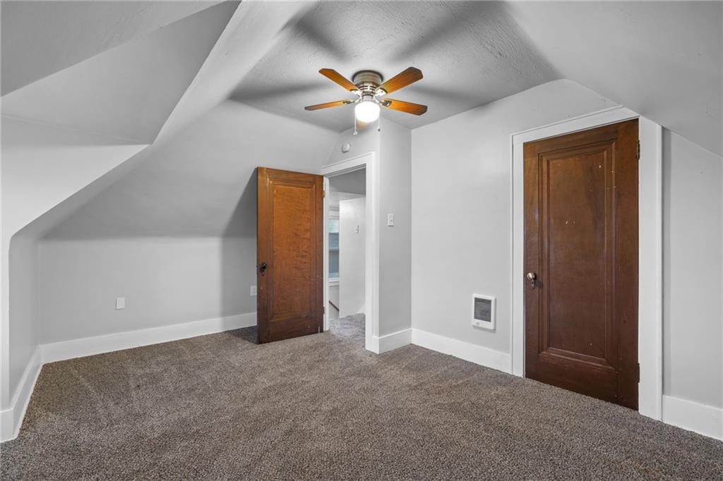 2923-2925 Brownsville Road Pittsburgh, PA 15227 - Photo 14 of 38 a view of a livingroom with a ceiling fan and window