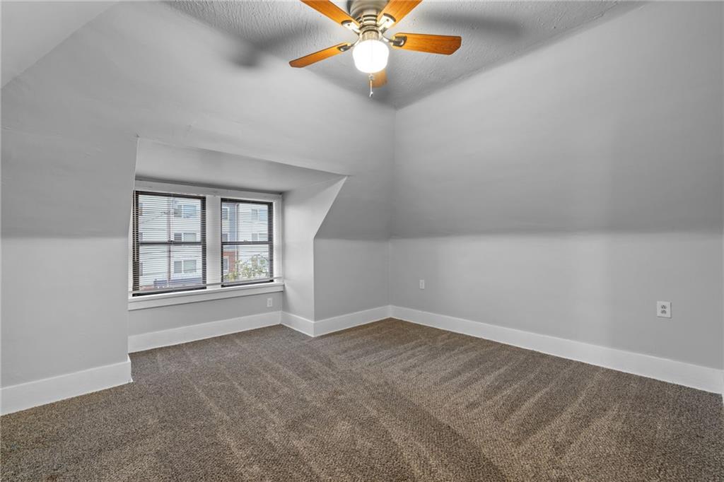 2923-2925 Brownsville Road Pittsburgh, PA 15227 - Photo 15 of 38 an empty room with windows and fan