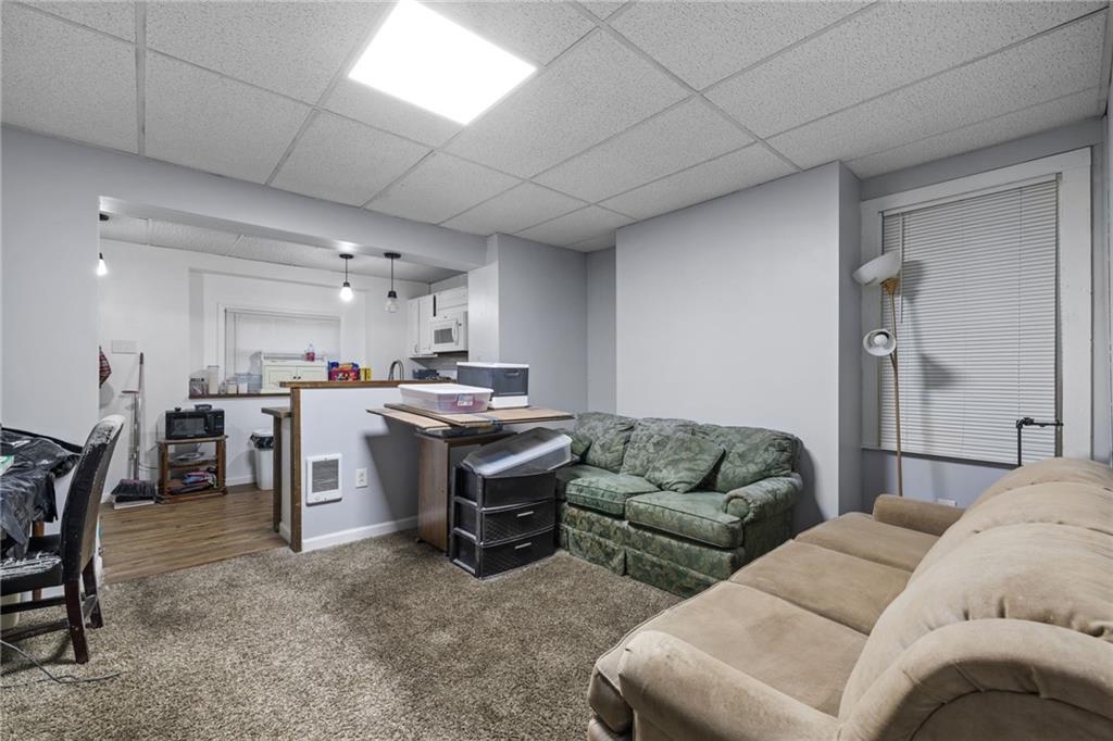 2923-2925 Brownsville Road Pittsburgh, PA 15227 - Photo 18 of 38 a living room with furniture and kitchen view