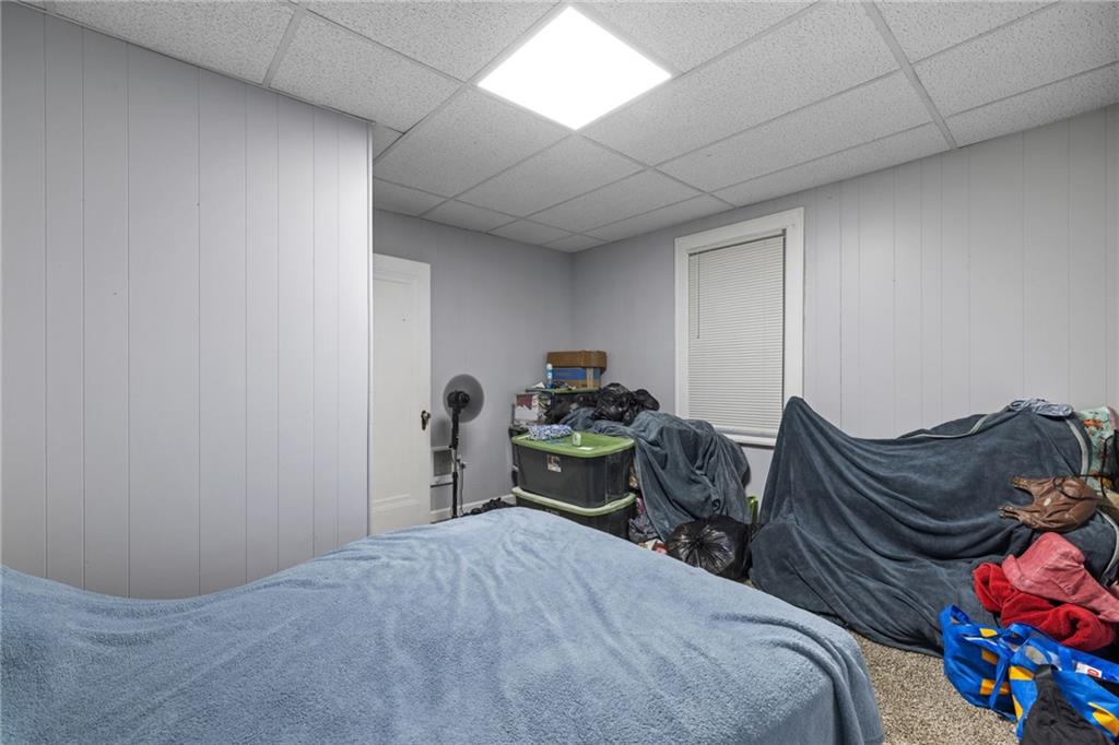 2923-2925 Brownsville Road Pittsburgh, PA 15227 - Photo 20 of 38 a bedroom with bed and a couch