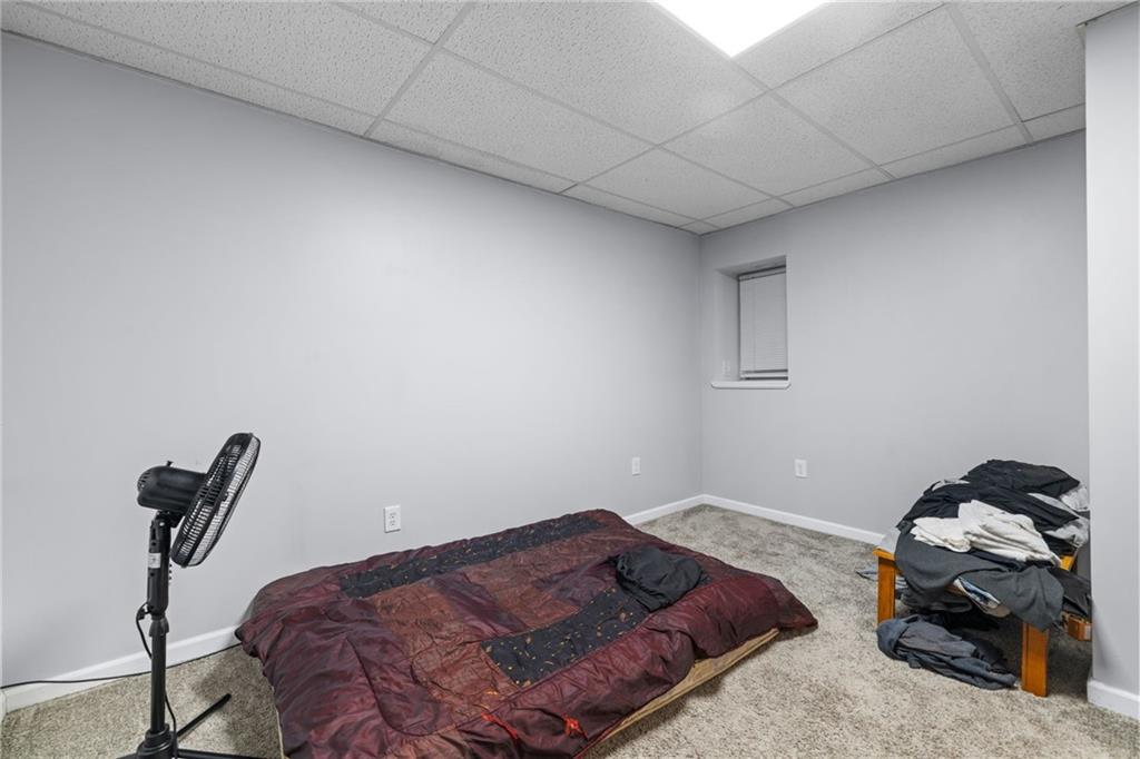 2923-2925 Brownsville Road Pittsburgh, PA 15227 - Photo 28 of 38 a bedroom with a bed and a window