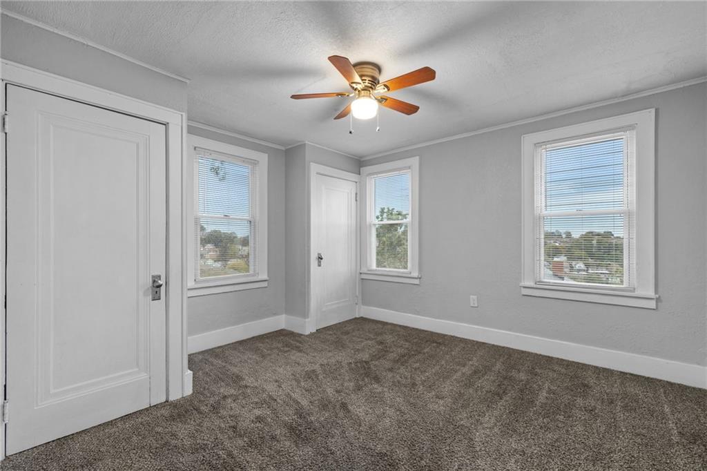 2923-2925 Brownsville Road Pittsburgh, PA 15227 - Photo 10 of 38 a view of an livingroom with a ceiling fan and window