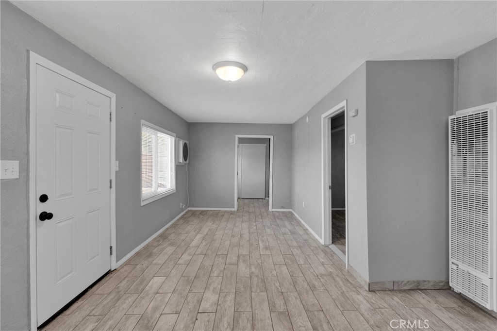 33454 Hampton Way Daggett, CA 92327 - Photo 7 of 17 a view of empty room with wooden floor and fan