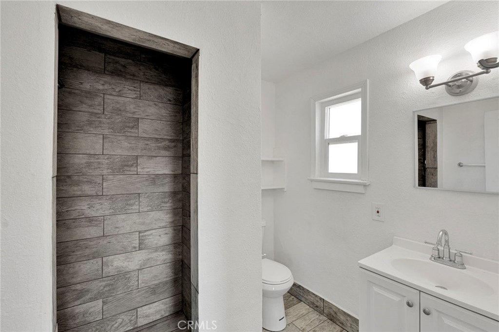 33454 Hampton Way Daggett, CA 92327 - Photo 8 of 17 a bathroom with a sink a toilet and shower