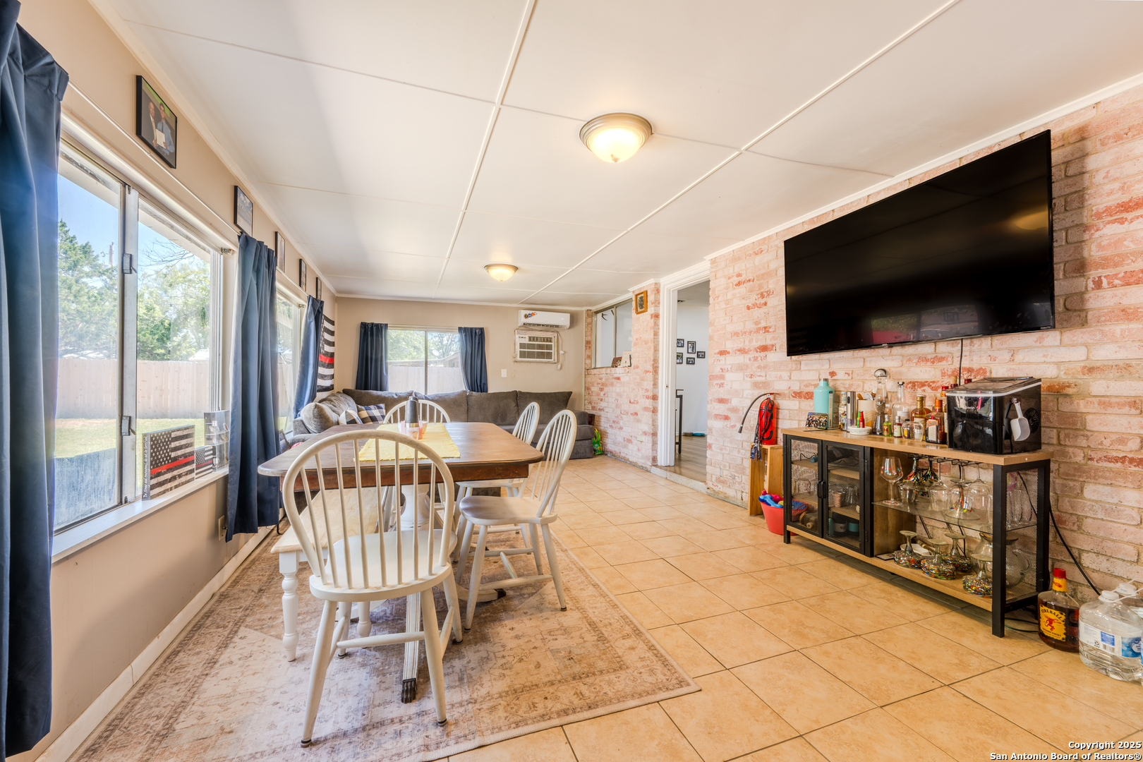 112 East Knippa Street Uvalde, TX 78801 - Photo 7 of 14 a view of a livingroom with furniture and a flat screen tv