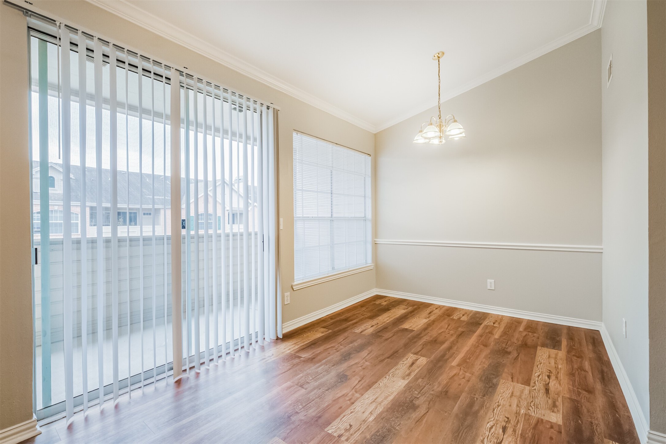 2111 Welch Street, Unit B304 Houston, TX 77019 - Photo 8 of 37 wooden floor in an empty room with a window