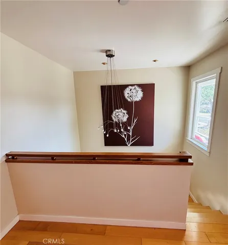 a view of a hallway with a wooden floor