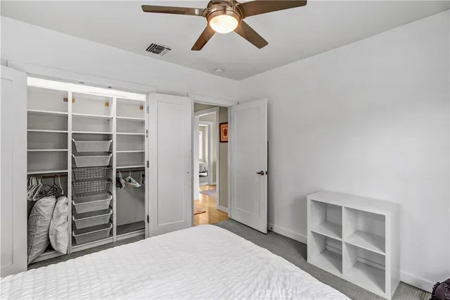 a bedroom with a bed and closet