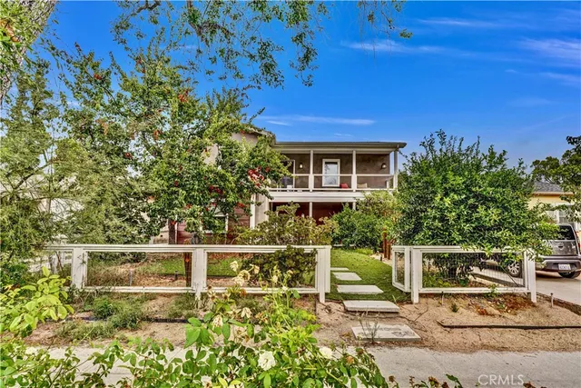 a house with trees in front of it