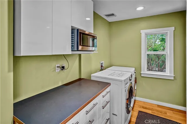 a utility room with a sink a washer and dryer