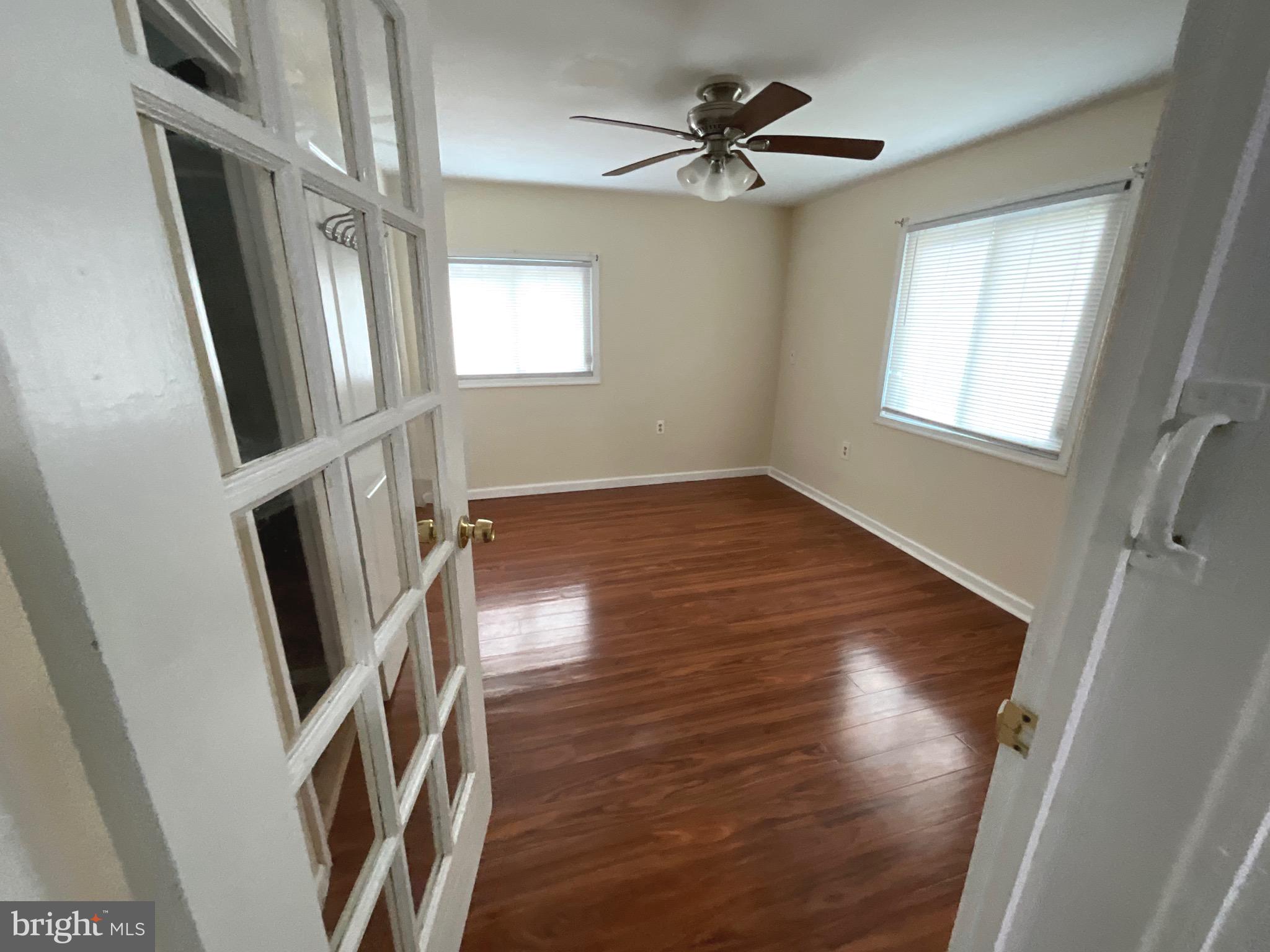 86 Kelley Road Fredericksburg, VA 22405 - Photo 19 of 36 a view of an empty room with wooden floor and a window