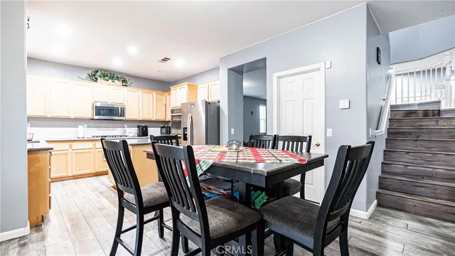 a dining room with furniture and window