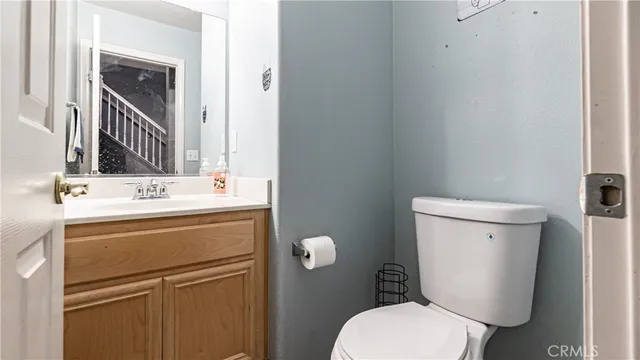a view of bathroom with a sink and mirror