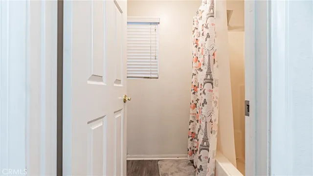 a bathroom with a shower curtain