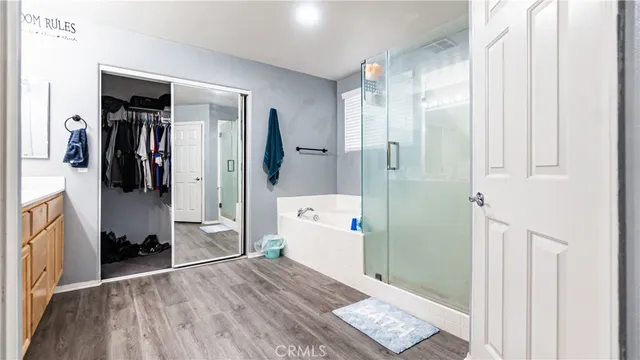 a bathroom with a bathtub and a shower