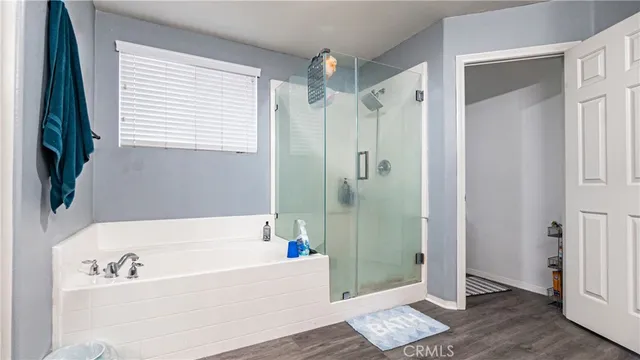 a white toilet sitting next to a white sink