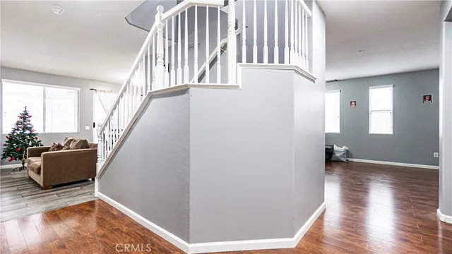 a view of an entryway with wooden floor