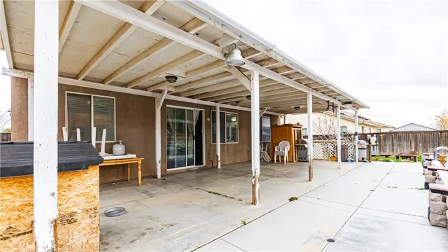 a front view of a house with a yard and seating space