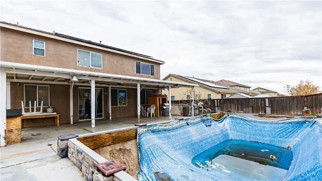 a view of a chair and table on the wooden floor