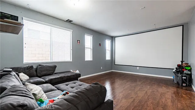 a living room with furniture and windows