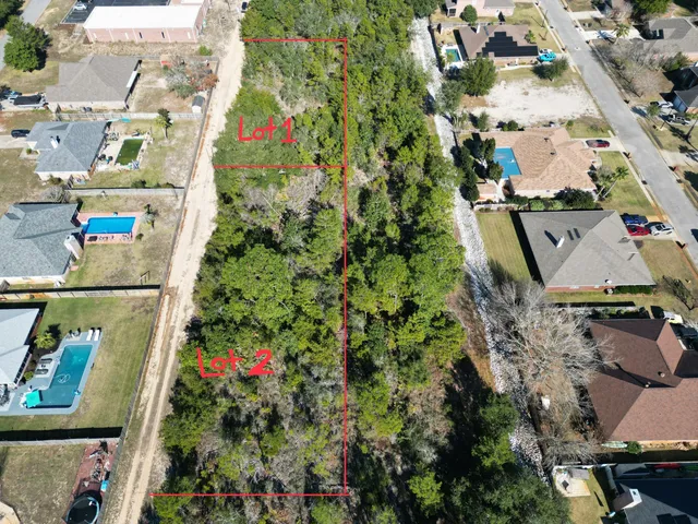 an aerial view of a house with a swimming pool