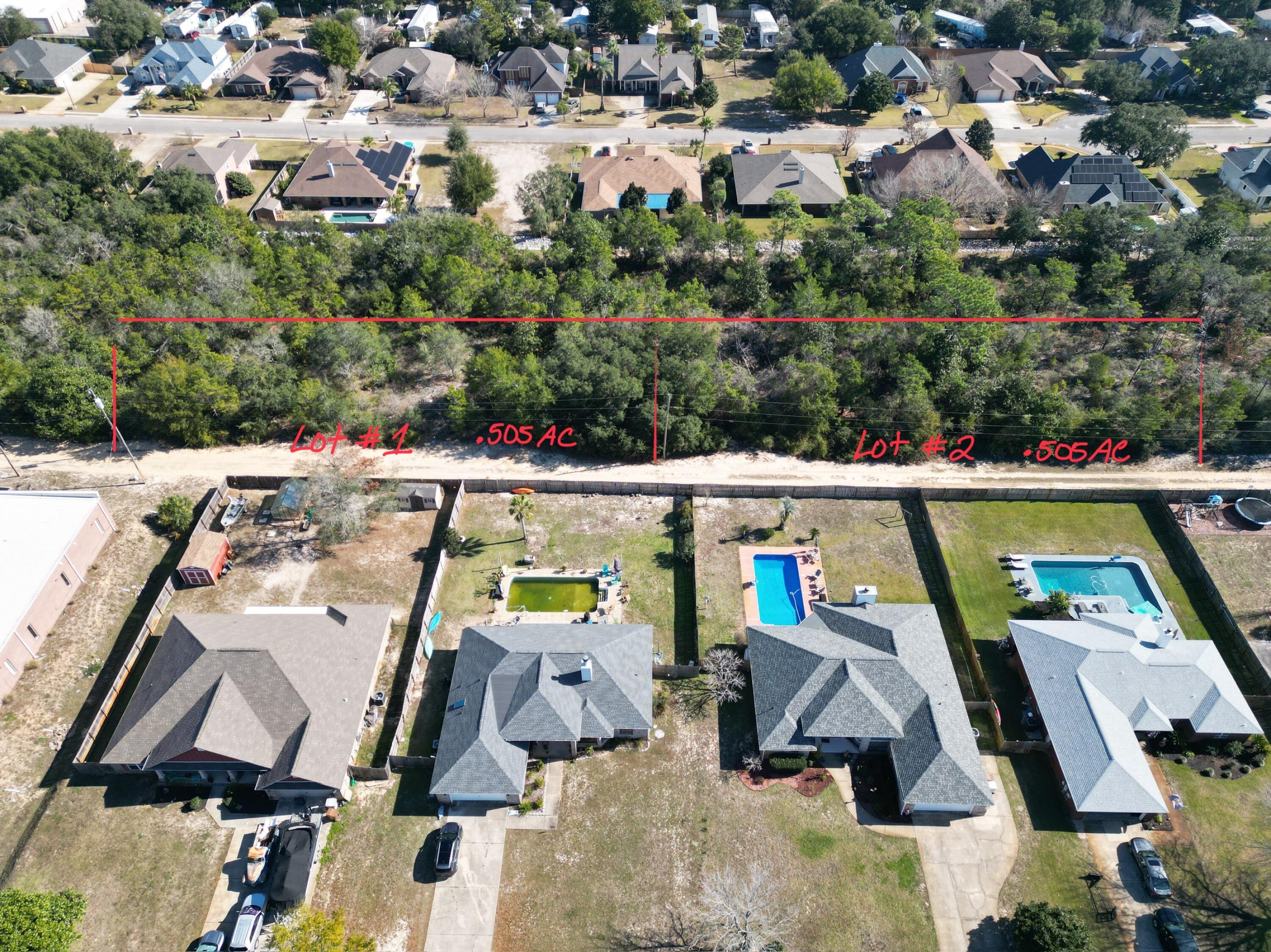 Xx Lillian Lane Navarre, FL 32566 - Photo 6 of 21 an aerial view of a house with a swimming pool