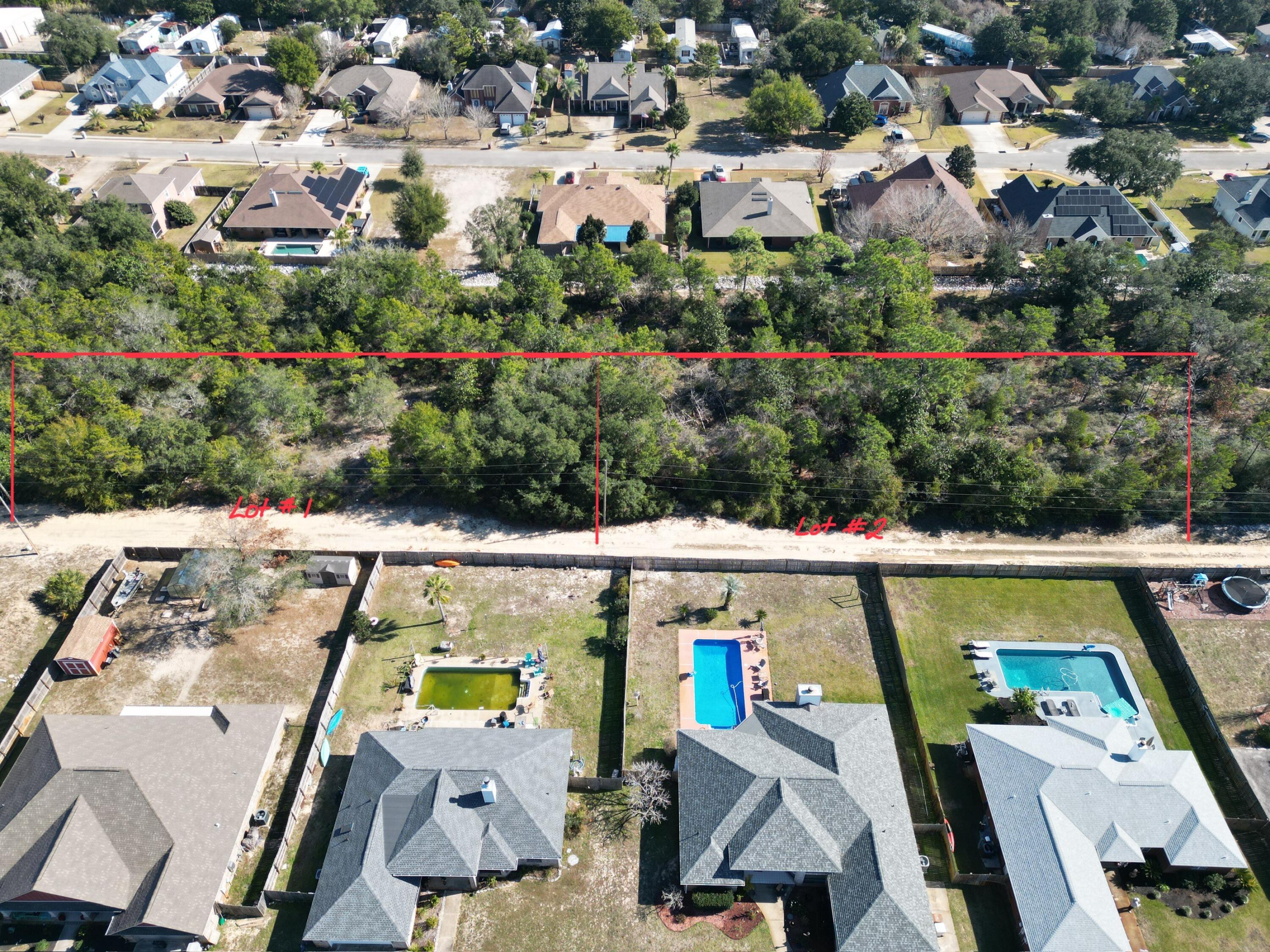 Xx Lillian Lane Navarre, FL 32566 - Photo 7 of 21 an aerial view of multiple houses with outdoor space