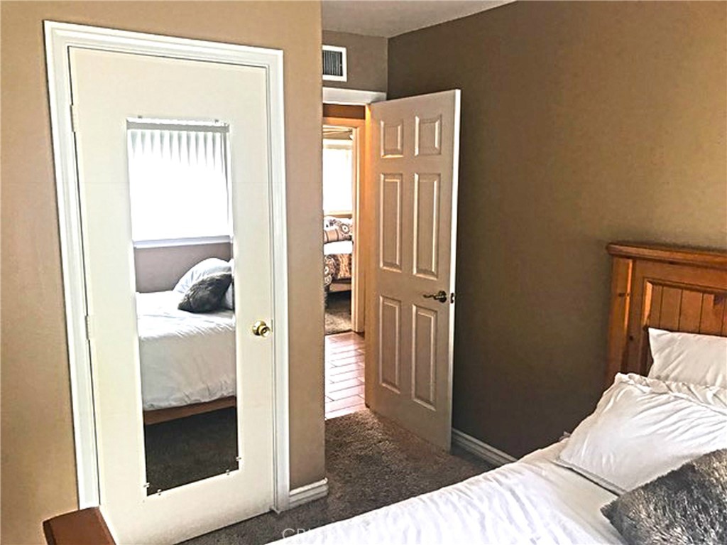 20011 Shorewood Circle Huntington Beach, CA 92646 - Photo 12 of 15 a bedroom with a bed and a window